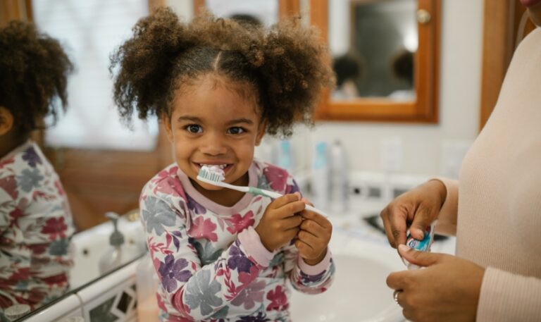 Baby brushing teeth
