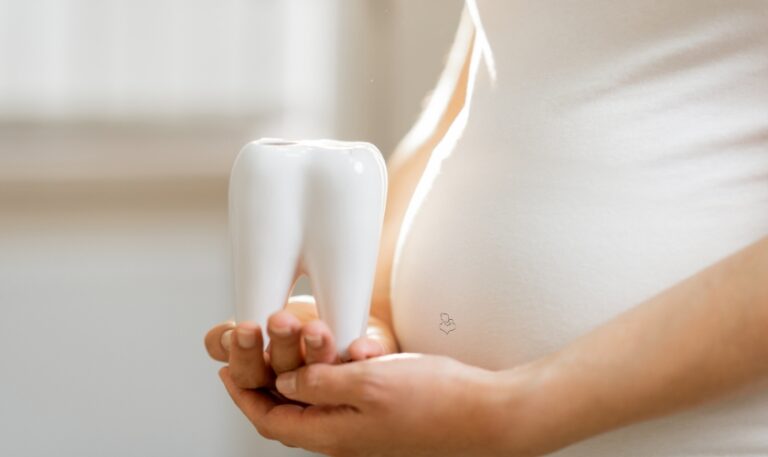 A women carrying a model of tooth